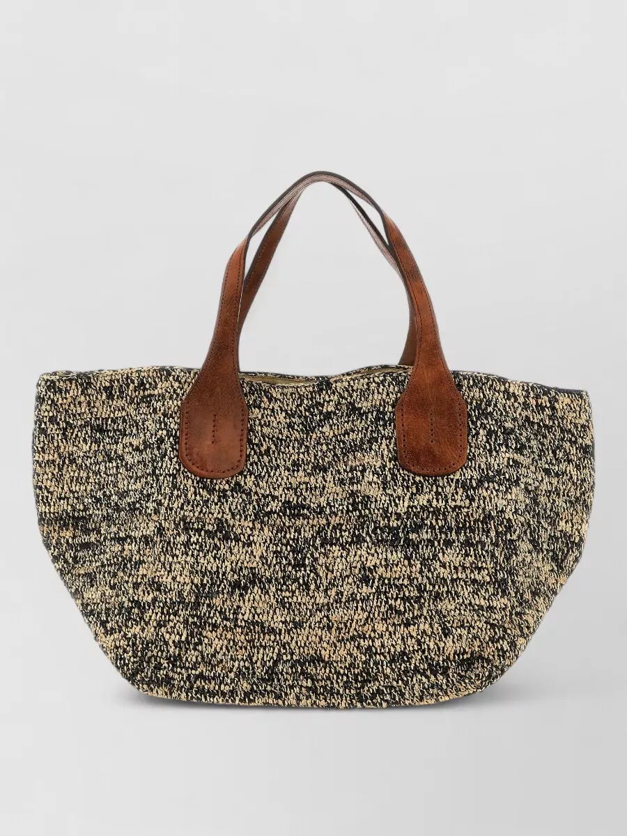 Ibeliv Raffia two tone woven tote bag — The Ibeliv straw tote with cognac leather trim reinforces the beach-to-terrace story, echoing the skirt’s ease while staying within a restrained, quiet luxury palette.