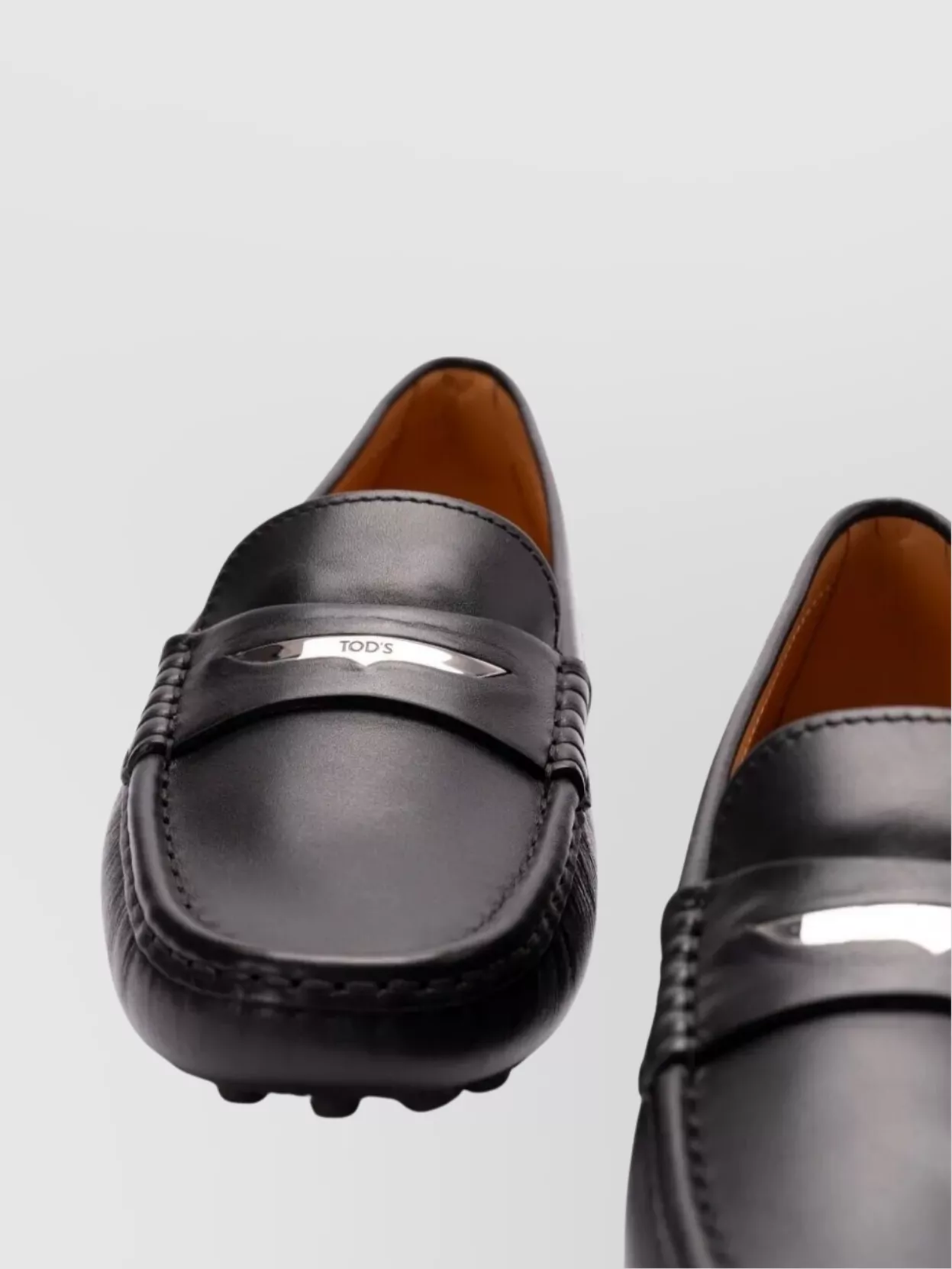 Tod's Round Toe Loafers Featuring Rubber Sole Design