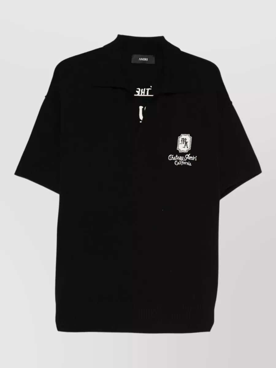 Amiri Ma chateau short-sleeve knit polo shirt — The black camp shirt keeps the palette tonal with the mesh shorts while its relaxed drape and subtle chest embroidery maintain that clean LA street-sport mood without competing textures.