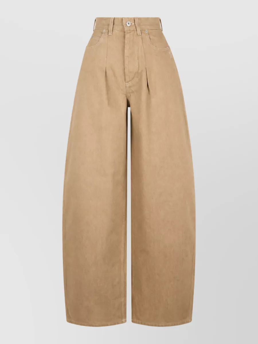 Jacquemus High-rise wide-leg trousers — The high-waist camel wide-leg trouser gives a clean, elongated line that mirrors the tee’s minimalist quiet-luxury mood and feels seasonally right for polished daytime dressing.
