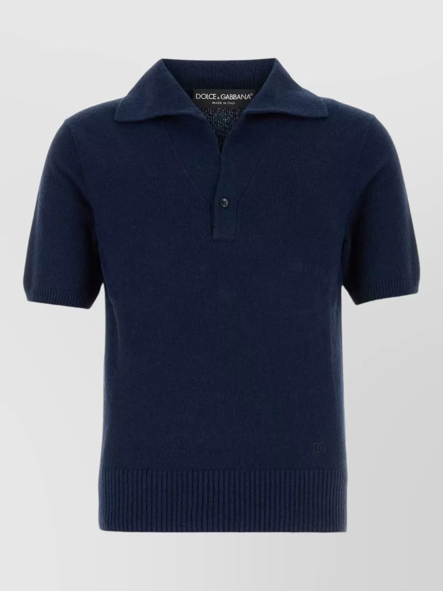 Dolce&Gabbana Polo shirt — The dusty steel-blue knit polo keeps the mood minimalist and quiet with a soft, tailored line that pairs elegantly with the navy shorts without feeling too matchy.