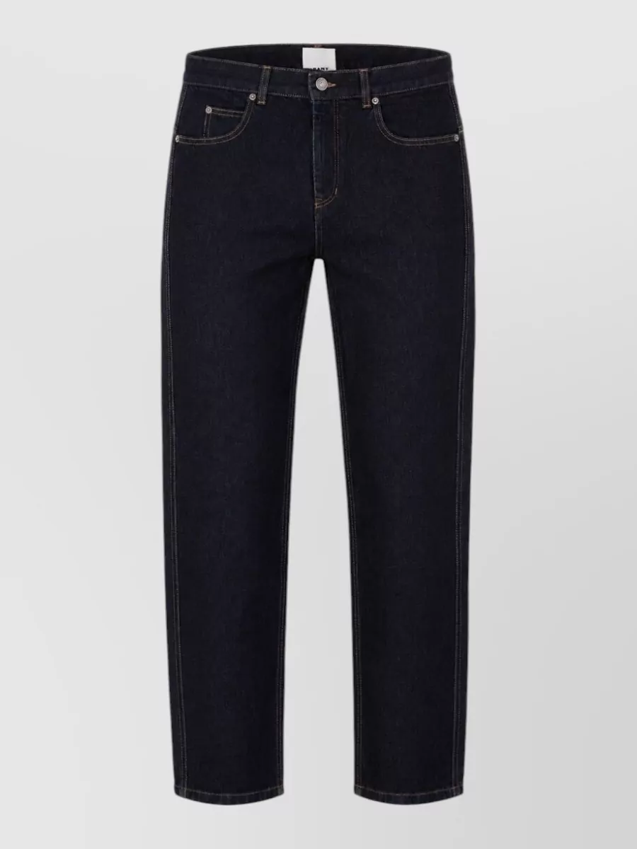 Isabel Marant Lewys denim jeans — The dark indigo regular straight-leg denim grounds the boxy jacket with a clean line and classic contrast stitching that suits the rugged, utilitarian mood.
