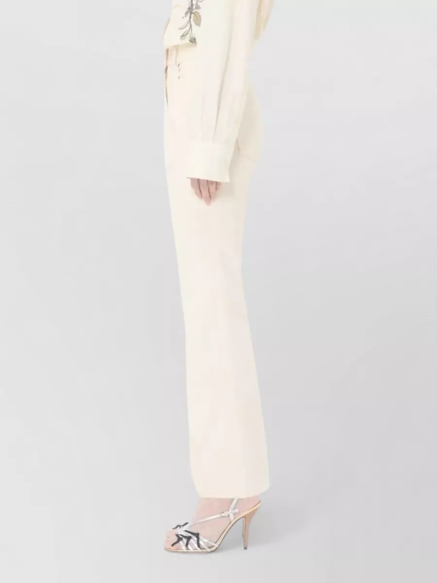 Valentino Garavani Flared Denim Trousers Featuring Pockets And Loops