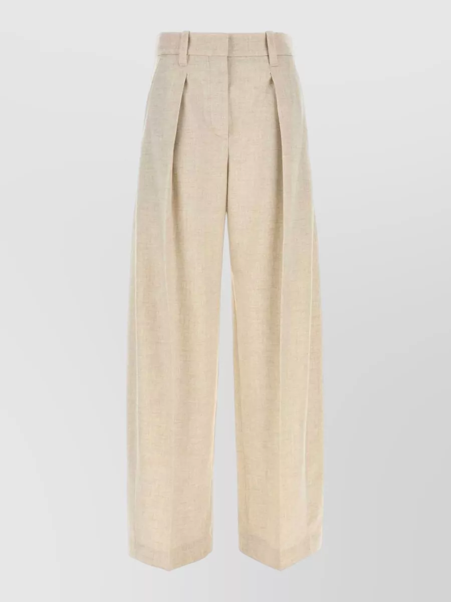 Brunello Cucinelli Wool and cashmere wide leg tailored trousers — The high waisted light beige wide leg keeps the suiting fully Brunello, mirrors the blazer’s elongated line, and softens the camel with a tonal, quietly formal column.