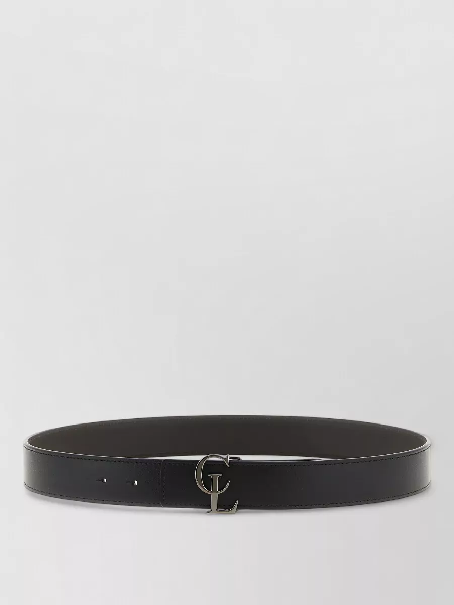 Christian Louboutin Leather reversible belt — The Christian Louboutin black leather belt keeps the waist clean and structured, reinforcing the pared-back, designer detail story without breaking the monochrome line.