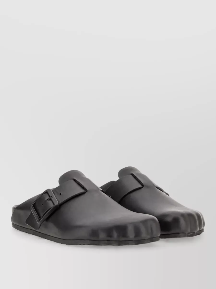 Balenciaga Leather sunday mules — The chunky black Chelsea boots echo the reference styling, ground the cropped hem cleanly, and keep the silhouette sharp and utilitarian without competing with the Rick details.