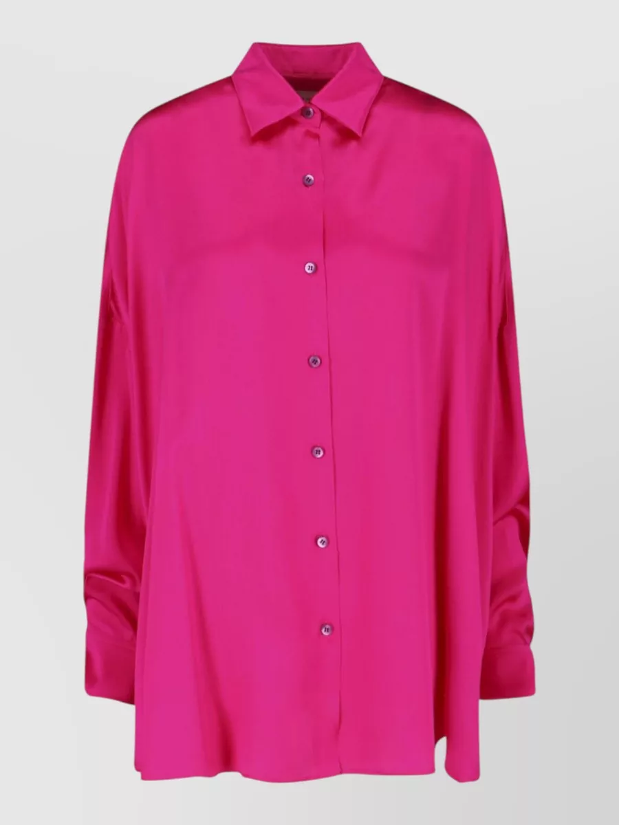 Dries Van Noten Silk oversized long-sleeve shirt — The saturated fuchsia shirt picks up the trouser’s pink, its clean oversized cut calms the print-on-print energy and lets the high waist and wide leg stay in focus.