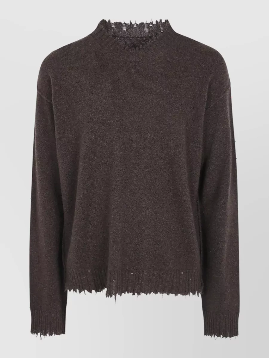 Uma Wang Cashmere round neck jumper — The dark distressed Uma Wang knit mirrors the hoodie’s deconstructed finish and palette, creating a coherent quiet-luxury FW story when layered together.