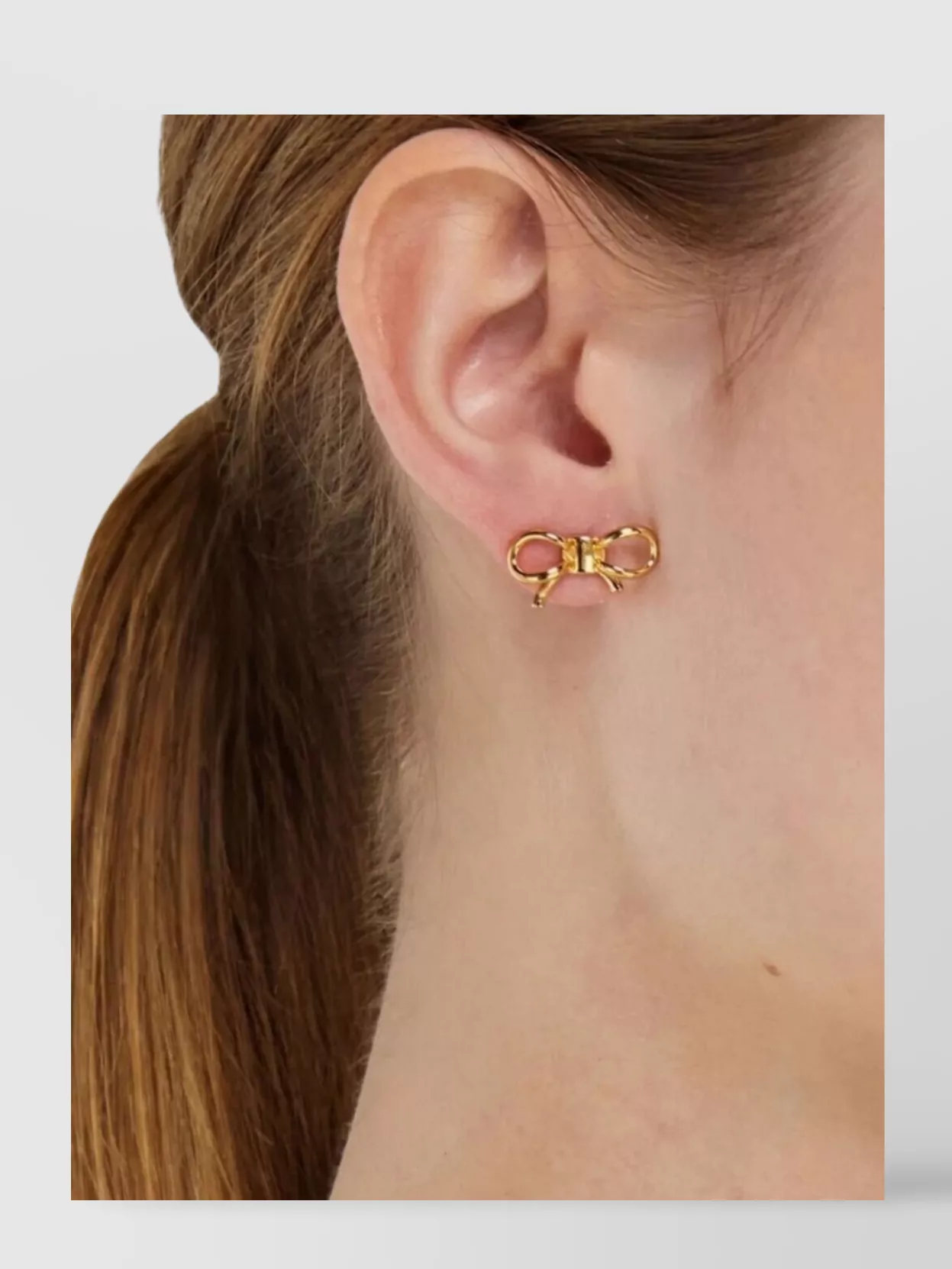 Ferragamo Stylish Bow Design Stud Earrings In Gold