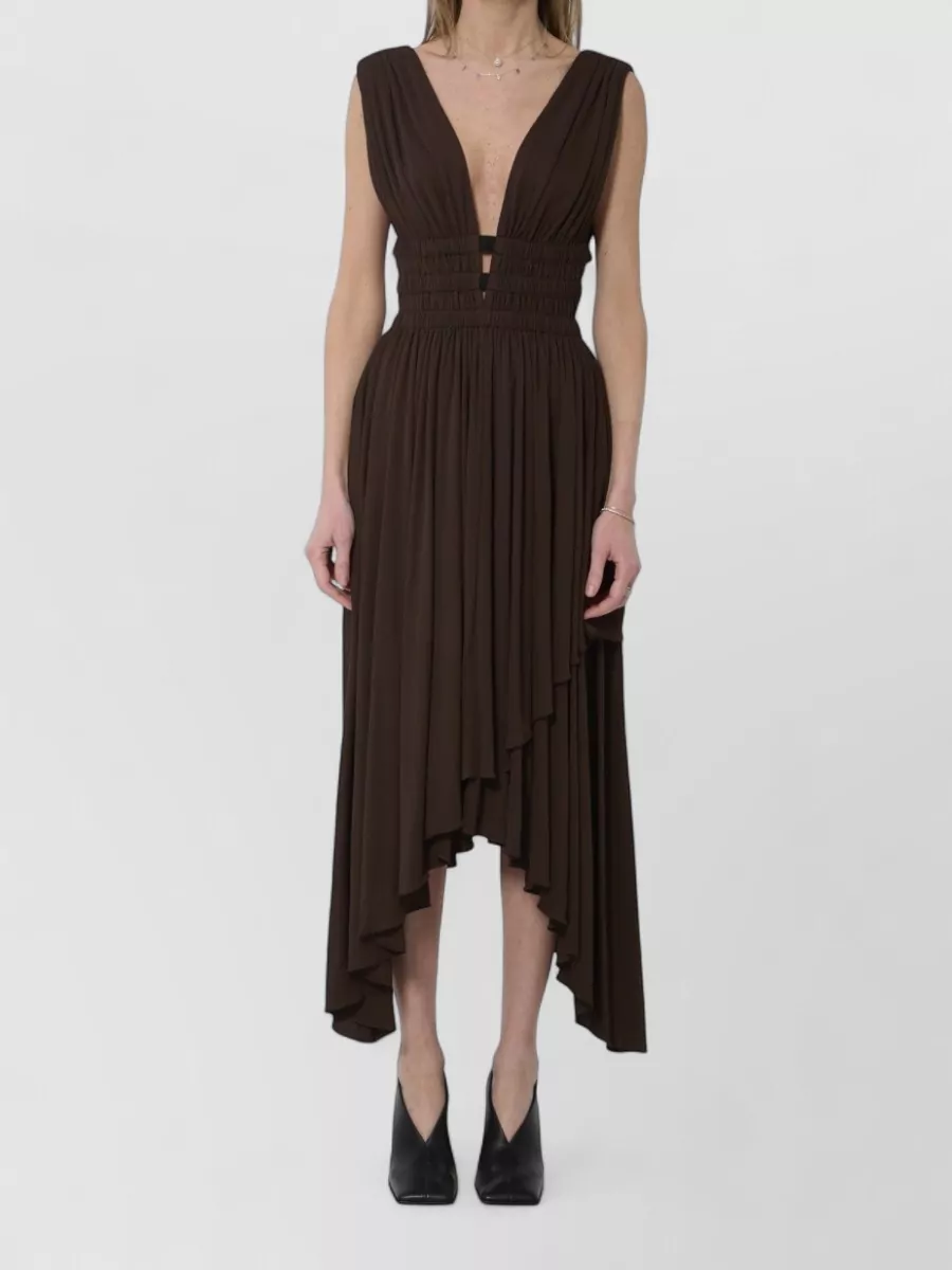 Alaïa Viscose asymmetric pleated v-neck midi dress — The Alaïa chocolate ruched asymmetric midi echoes the bag’s tan-brown tones while keeping a minimalist, quietly luxurious evening feel that suits the structured top-handle bag better than a tailoring-based separates story.