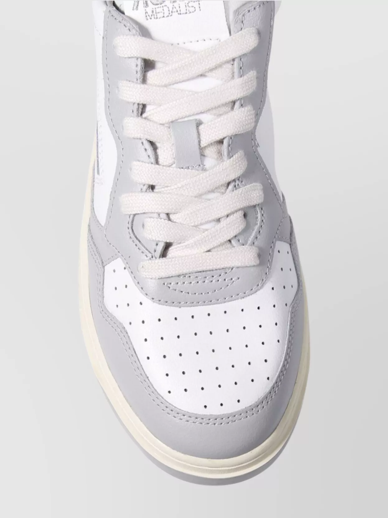 Autry Low Sneaker With Contrast Sole And Perforated Toe