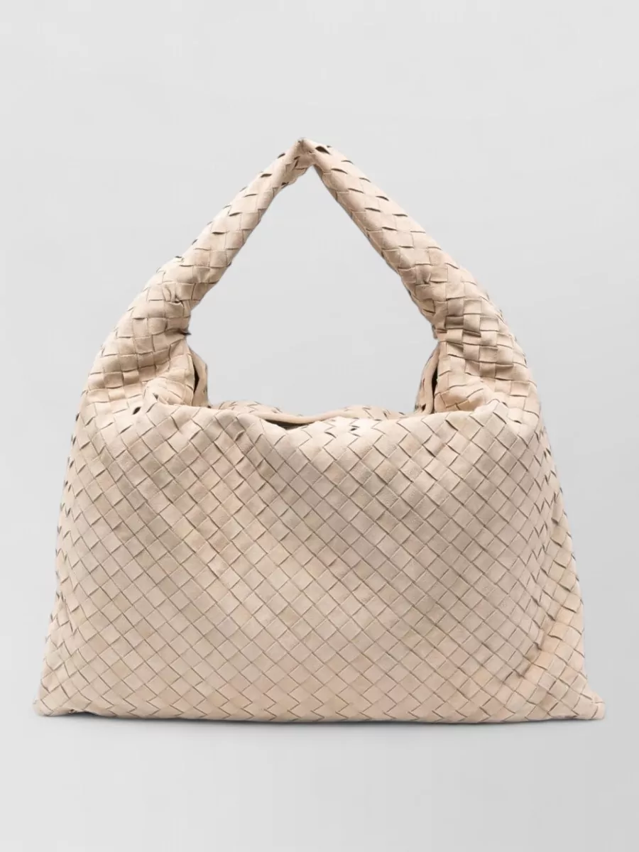 Bottega Veneta hop large leather shoulder bag — The Bottega Veneta slouchy woven hobo in warm beige extends the tonal story and relaxed silhouette, adding texture and volume while remaining quietly opulent beside Brunello knits.
