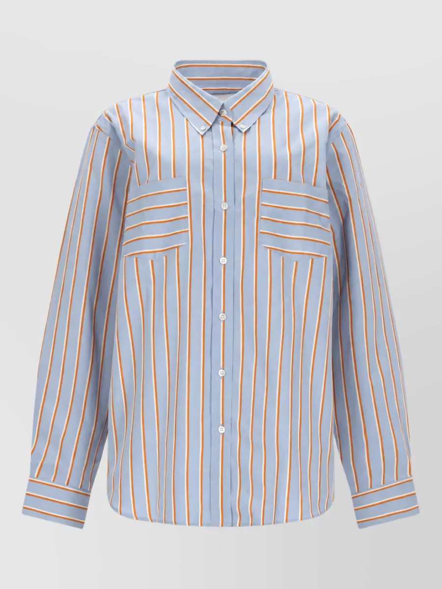 Dries Van Noten Striped cotton shirt — The Dries striped shirt in soft blue and orange intentionally echoes the pyjama stripe of the trouser, creating a cohesive, graphic set that still reads refined rather than literal loungewear.