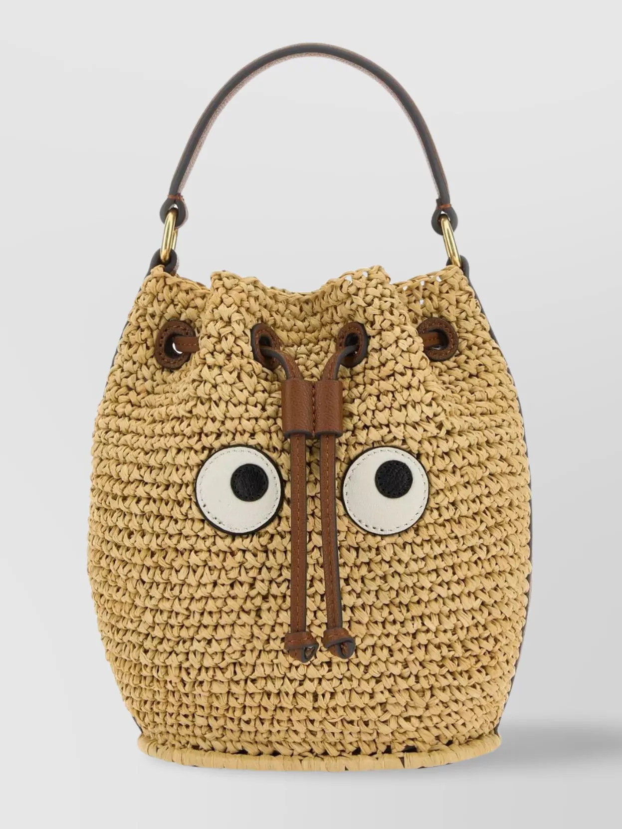 Shop Anya Hindmarch Raffia Drawstring Bucket Bag With Animal Face Design In Beige