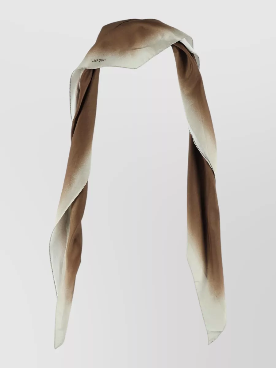 Lardini Silk blend printed scarf — Lardini’s warm brown to ivory gradient scarf quietly picks up both the shirt’s chocolate and the trouser’s off-white, adding a soft vertical line that suits the relaxed, lounge-adjacent styling.