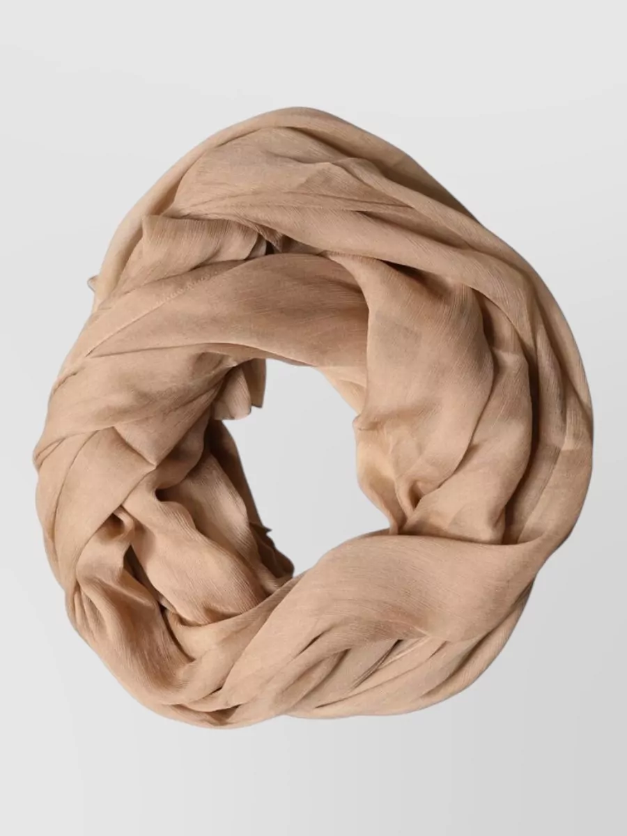 Dolce&Gabbana Silk scarf — The sheer warm-beige scarf adds a soft romantic layer within the same sand-ivory spectrum, enhancing movement around the neckline without introducing distracting color.
