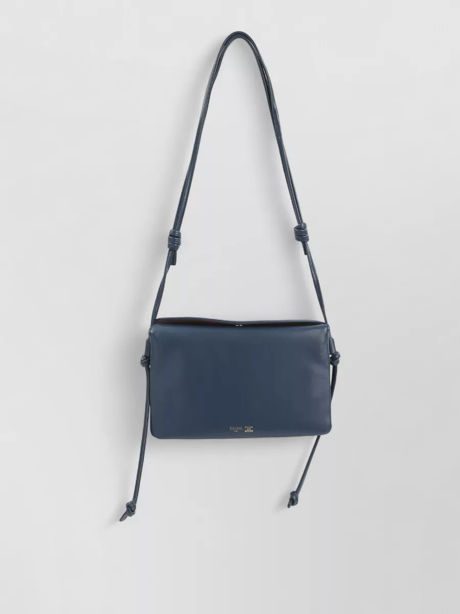 Celine Lamb leather shoulder bag — Celine’s slim navy crossbody echoes the cardigan’s tone, keeps the palette tight and minimal, and adds just enough structure to balance the softness of the head-to-toe knit.