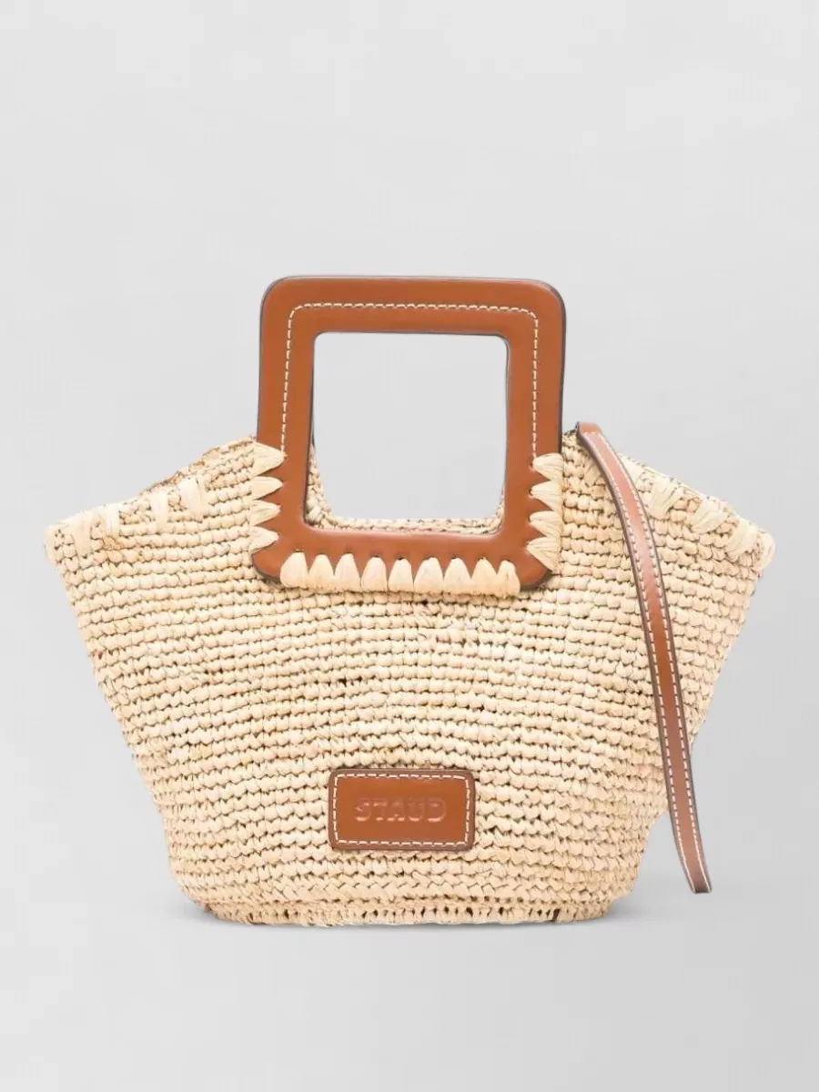 Staud shirley mini raffia tote bag — The straw and tan mini Staud tote leans into the summery, preppy feel and ties in tonally with the brown sandals for a cohesive warm-weather palette.