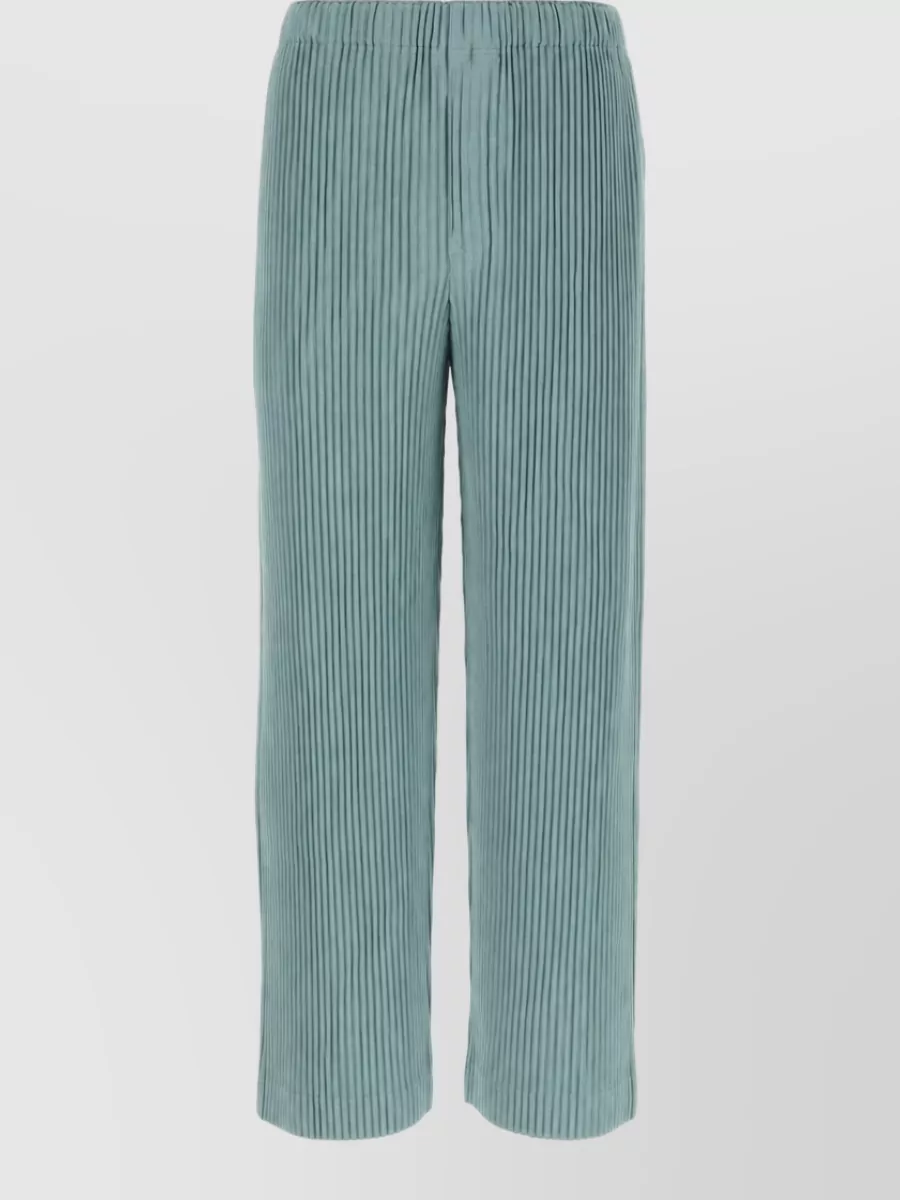 Homme Plisse Issey Miyake Wide-leg trousers — The sage teal wide-leg trouser creates a relaxed monochrome column with the dusty teal top, keeping the pleated architecture and quiet streetwear mood fully aligned in both palette and silhouette.
