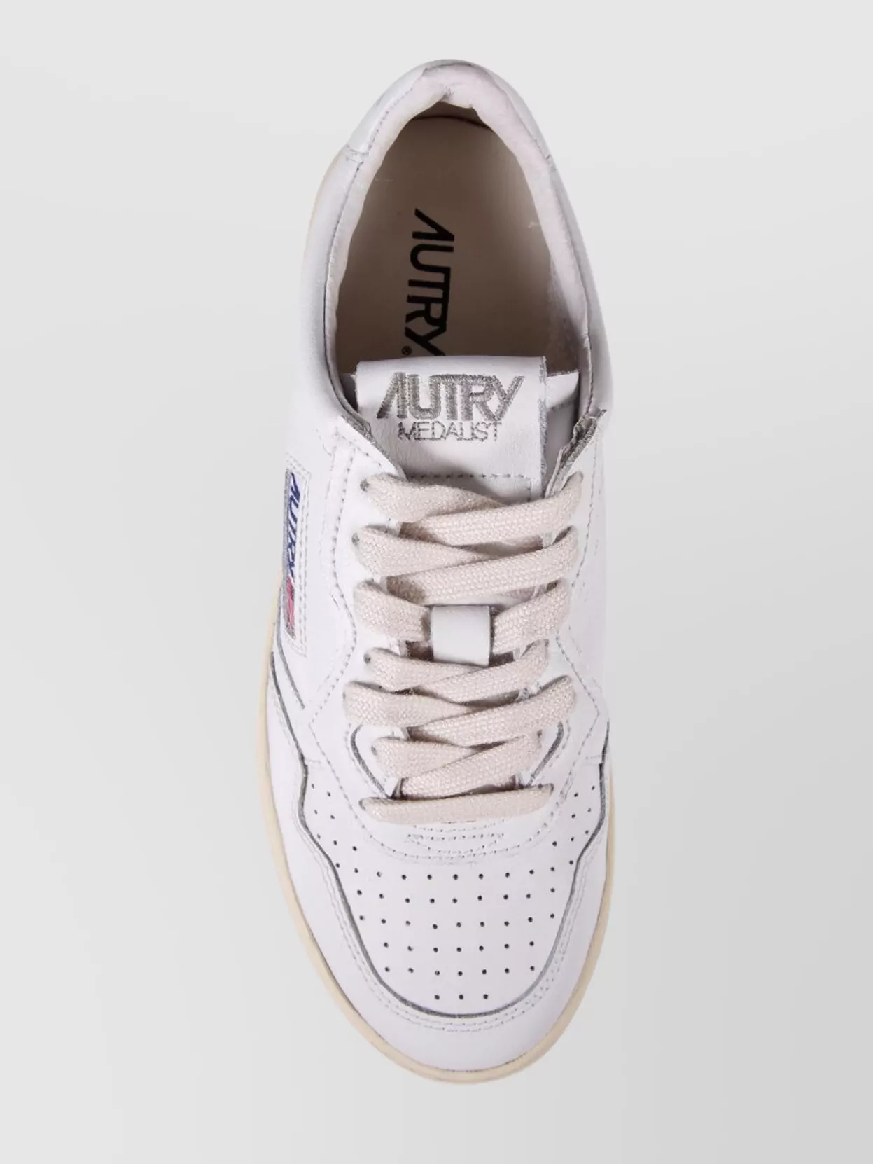 Shop Autry Low Sneaker With Perforated Detailing And Rubber Sole