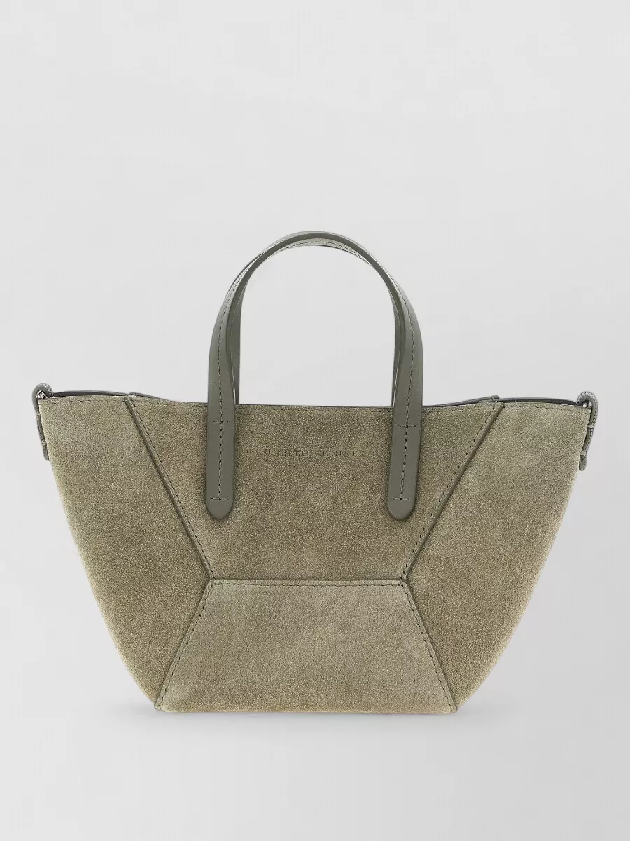 Brunello Cucinelli Na suede tote bag — The small moss-taupe structured tote in B mirrors the earthy olive-taupe palette and refined geometry of the look, giving a high-end but understated finish that feels perfectly scaled to the cropped trouser and relaxed shirt.