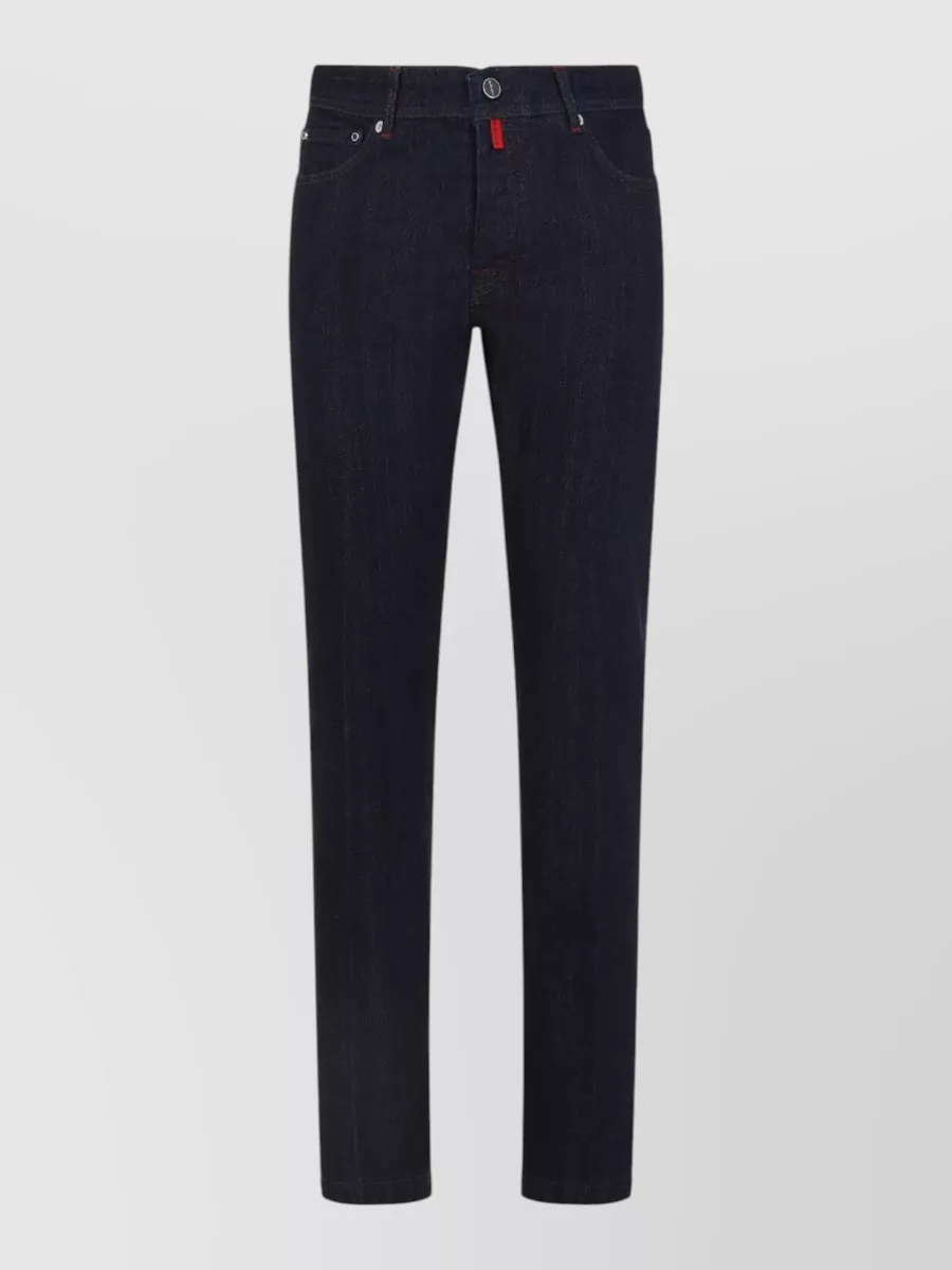 Kiton Straight-leg jeans — The light beige Kiton drawstring trouser keeps the mood relaxed yet polished, opens up the navy tee with a soft contrast, and aligns perfectly with the quiet luxury, warm-weather brief.