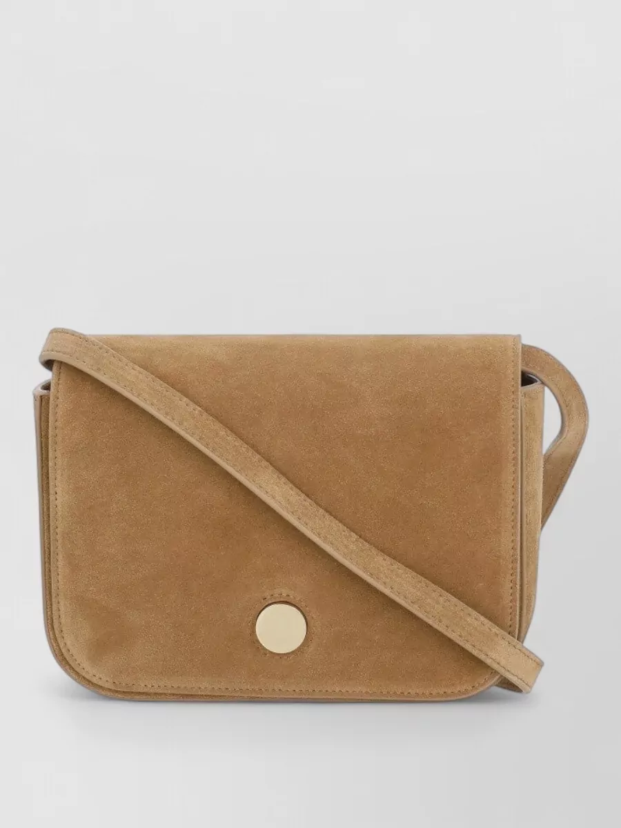 Fabiana Filippi Leather shoulder bag — The A.P.C. olive-brown suede shoulder bag harmonizes with the shirt’s khaki tone for a tonal top-half story, its minimal structure and tactile finish reinforcing the quiet-luxury utility feel.
