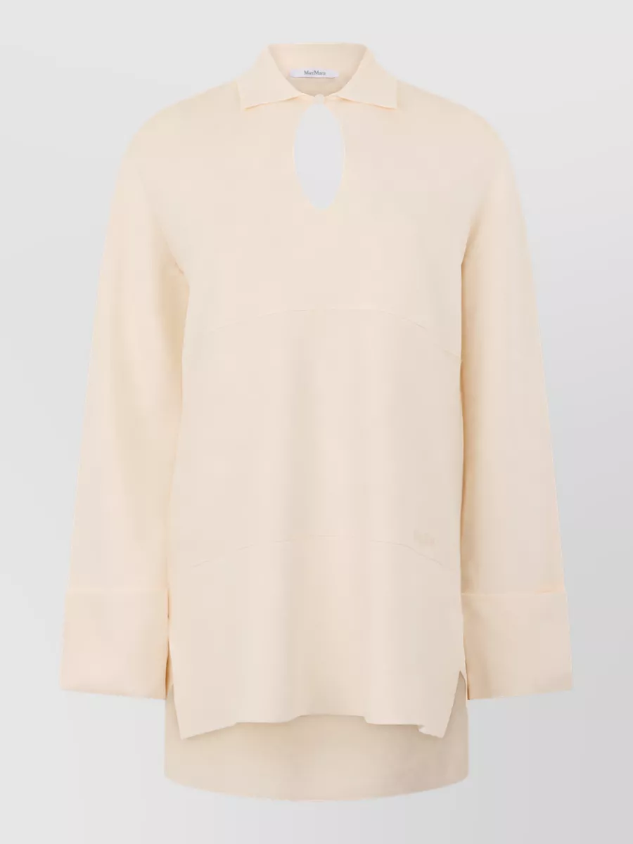 Max Mara Long-sleeve blouse — The soft-cream longline tunic mirrors the trouser’s tone and relaxed polish, creating a fluid monochrome column that suits the loungey, quiet luxury mood and keeps formality aligned at level 2.