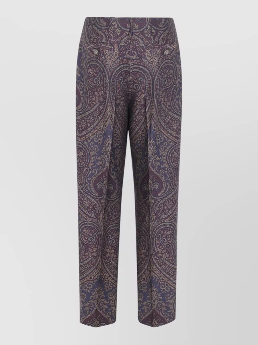 Etro Wide leg trousers — The inky black and lilac Pucci wide-leg mirrors the top’s graphic geometry while keeping the palette moody and sophisticated, creating a fluid head-to-toe statement that reads polished rather than busy.