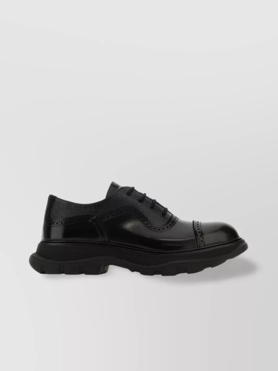 Shop Alexander Mcqueen Polished Leather Lace-up Shoes With Brogue Detailing In Black