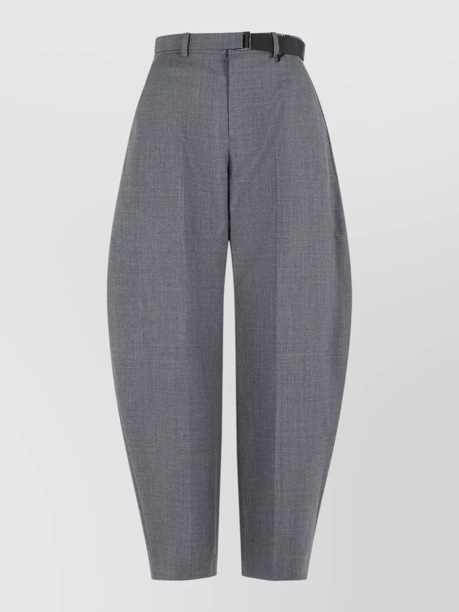 Sacai Straight-leg tailored trousers — The mid grey sculpted tapered trouser keeps the Sacai language consistent while giving a precise, architectural counterpoint to the cream boxy knit and maintaining a calm minimalist palette.