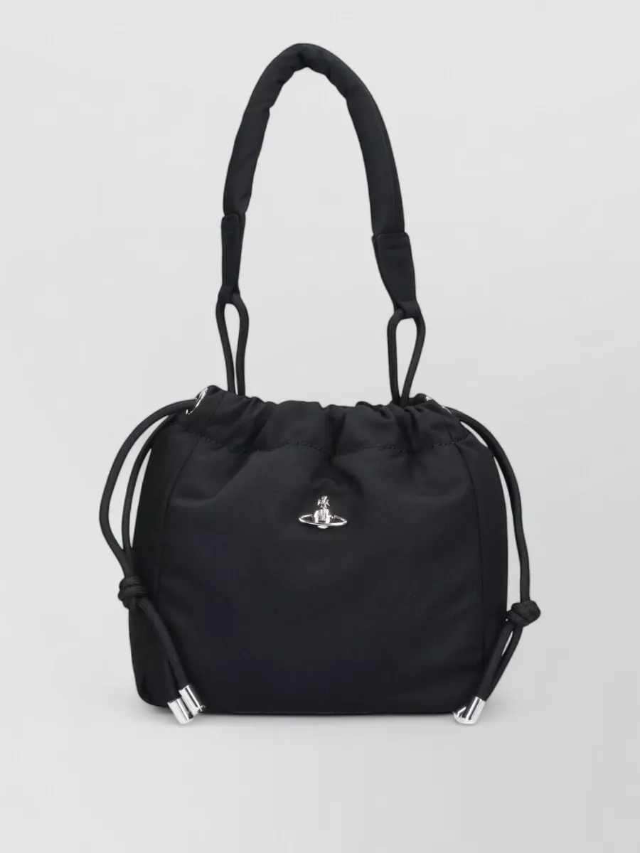 Vivienne Westwood Na shoulder bag — The Vivienne Westwood black nylon drawstring bag adds a subtle street edge, matches the sporty attitude and price tier of the sneakers, and keeps the whole setup light and functional.