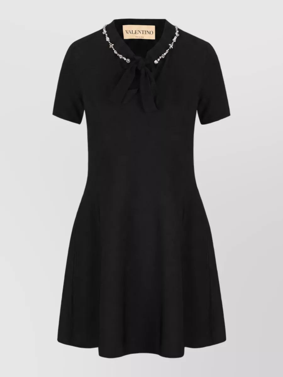 Valentino Garavani Fine-knit crystal-embellished bow-detail crew-neck short-sleeve flared knee-length dress