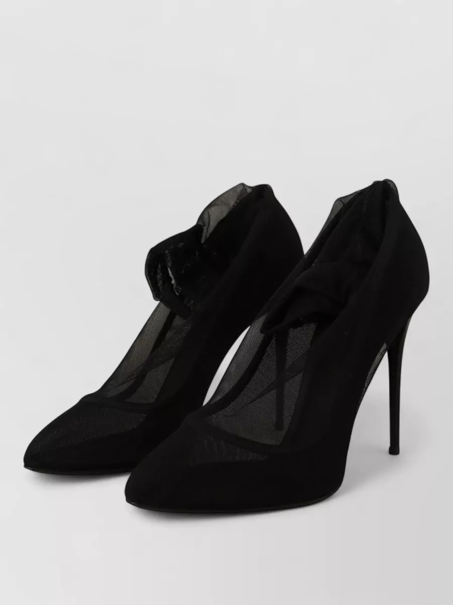 Dolce&Gabbana Mesh gathered pumps — The black lace pumps mirror the hosiery’s floral lace and sit perfectly with the dress’s formality, adding Sicilian drama without overwhelming the leg.