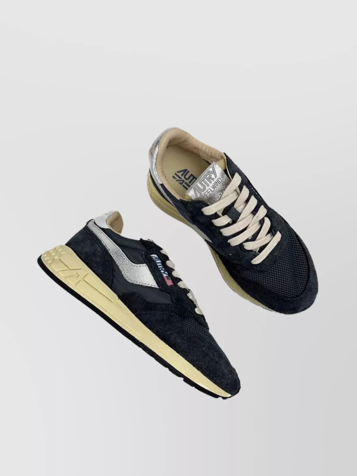 Autry Low Top Sneakers Featuring Silver Accents