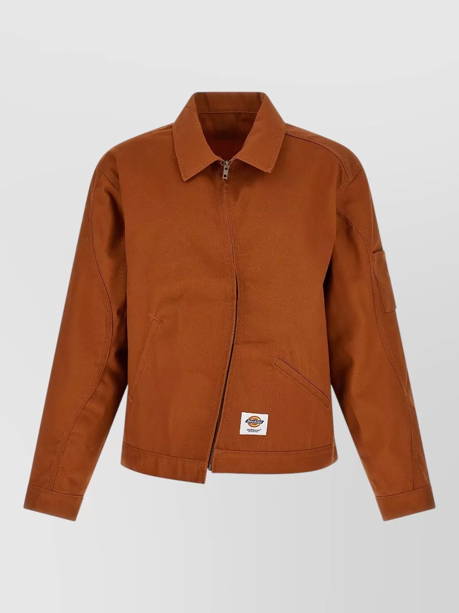 Undercover asymmetric single-breasted coat