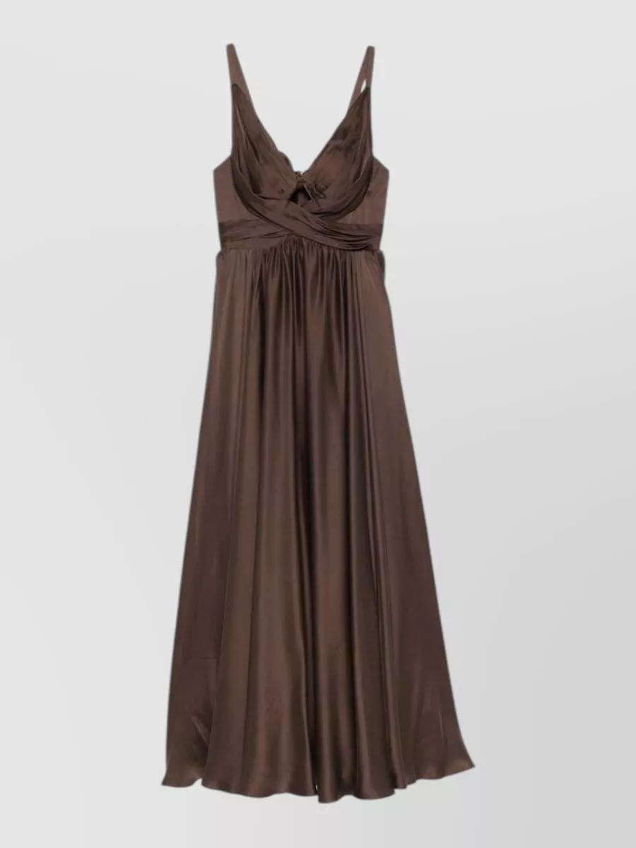Zimmermann Silk draped cutout v-neck maxi dress — The chocolate satin maxi mirrors the jacket’s rich brown palette and quiet-luxury mood, creating a sleek column under the cropped faux-fur for an evening-ready, coherent silhouette.