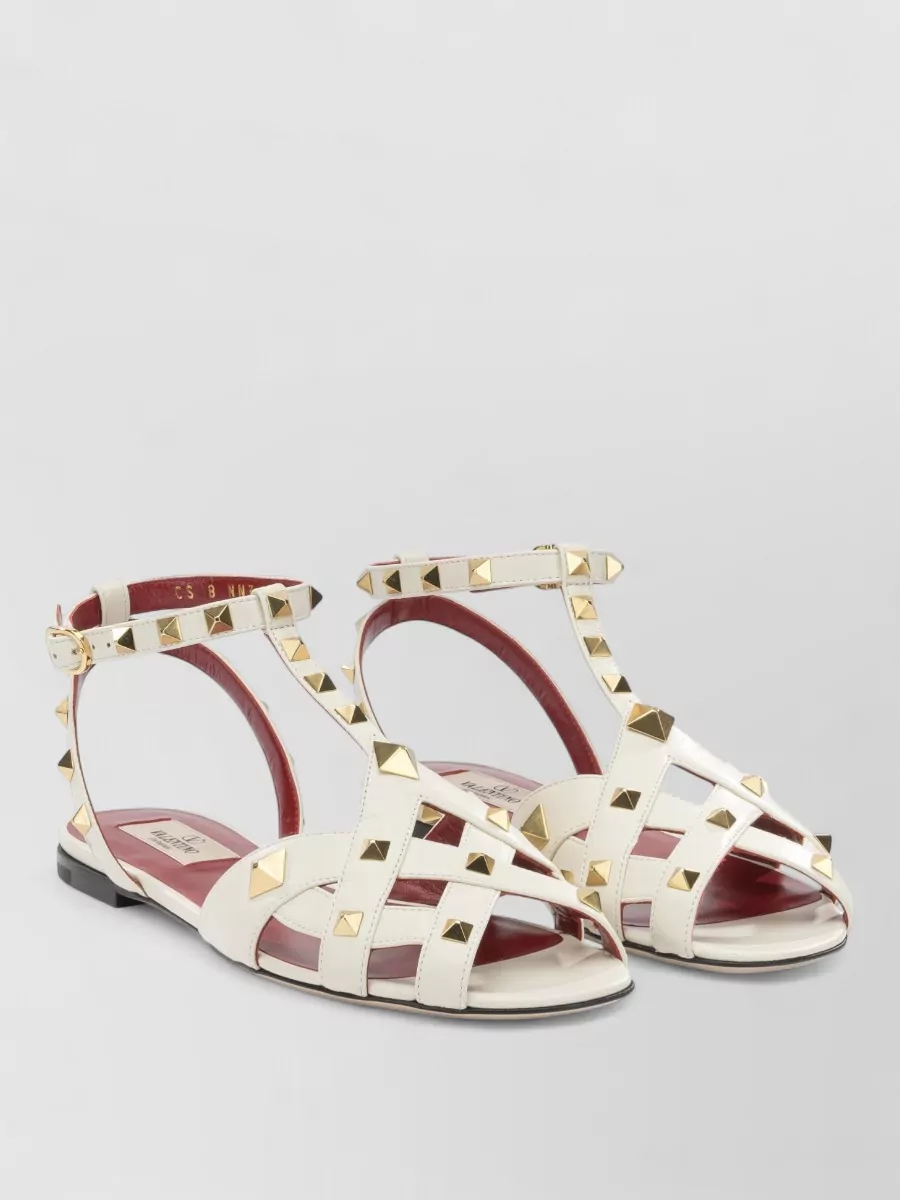 Valentino Garavani Flat Sandals Ankle Strap Open Toe Studs In Neutral
