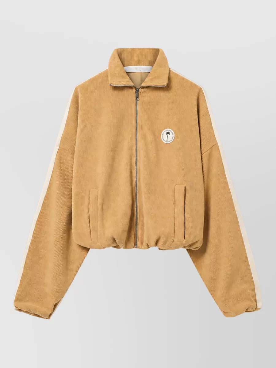 Palm Angels Chenille track jacket — The matching camel corduroy track jacket creates a cohesive Palm Angels set with the pants, keeping the sporty streetwear mood and wide-leg proportions clean and intentional for cool-weather off-duty wear.