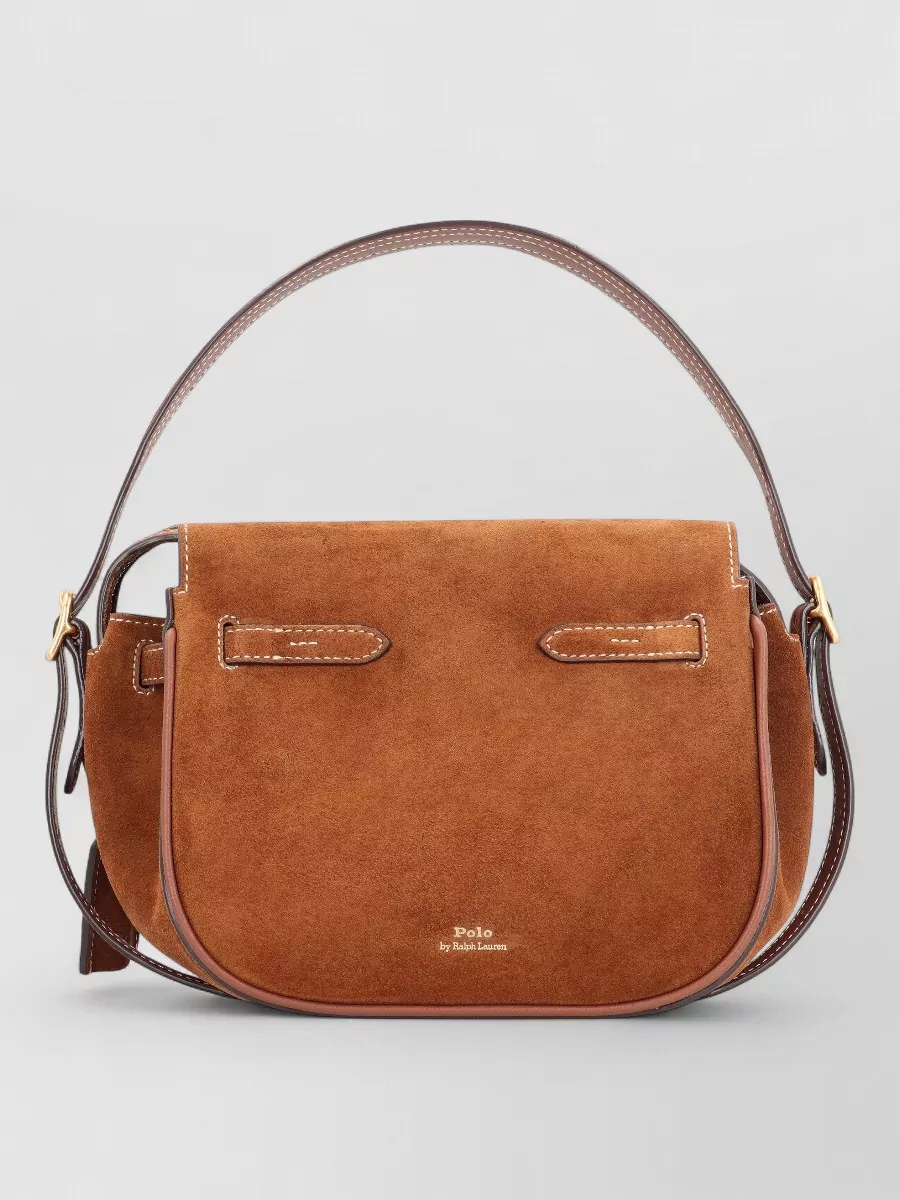 Polo Ralph Lauren Suede mini shoulder bag — The caramel and chocolate suede shoulder bag harmonises with the camel skirt and brown loafers, reinforcing the rich autumnal palette while staying polished and quietly equestrian.