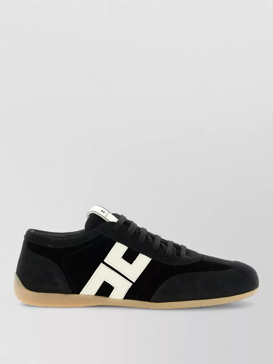 Elisabetta Franchi Leather low-top lace-up sneakers — The Elisabetta Franchi low-top sneaker in black with bold contrast logo and gum sole reinforces the matching brand story and sporty-preppy vibe while staying streamlined enough for the tailored trouser.
