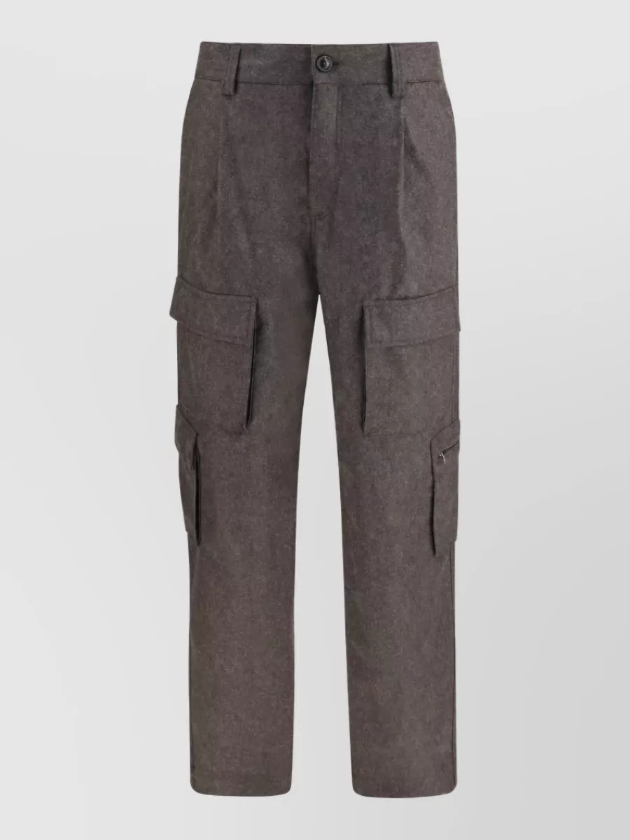 Brunello Cucinelli Wool flannel pleated cargo pants — The tapered wool cargo in charcoal brown continues the refined utility theme, balancing the belted coat’s volume with a clean leg and a deep neutral that anchors all the olives and browns.