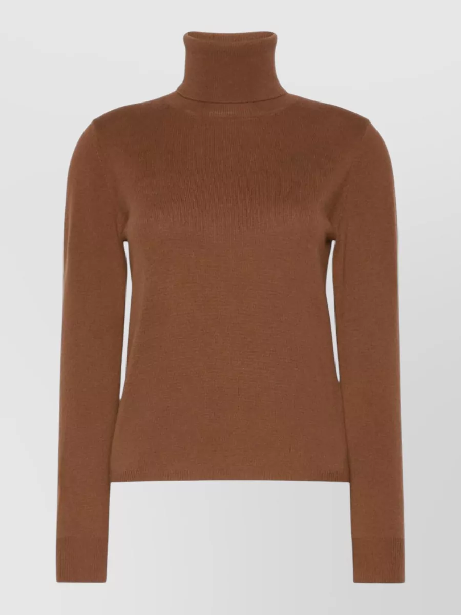 S Max Mara Wool cashmere ribbed turtleneck sweater — The S Max Mara caramel turtleneck layers smoothly under the relaxed taupe coat, keeping the palette warm and minimalist without adding bulk or competing structure.
