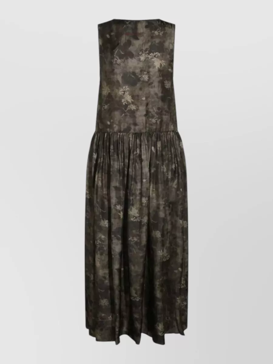 Uma Wang Printed sleeveless midi dress — The Uma Wang sleeveless floral maxi in charcoal brown and moss taupe echoes the bag’s earthy boho mood and fringe movement, creating a cohesive, relaxed FW column that feels artful yet easy.
