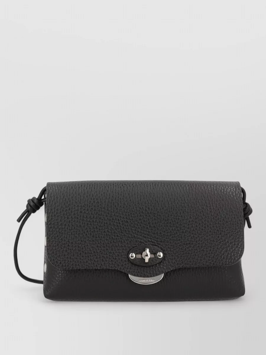 Zanellato Leather cross-body bag — The small black Zanellato cross-body is quietly polished and compact, matching the jacket’s ease and dress’s sleekness without introducing new color or visual noise.