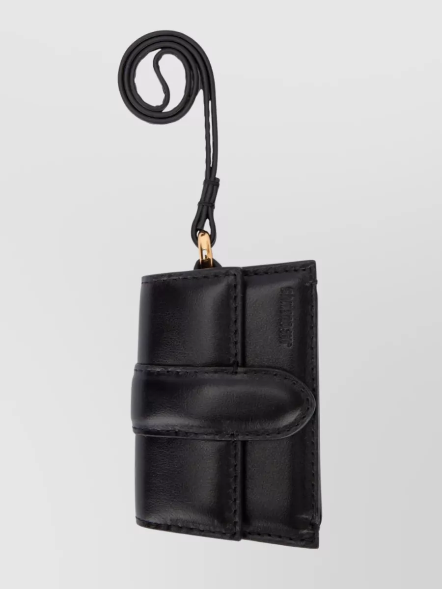 Shop Jacquemus Strap Detail Wallet With Gold-tone Hardware In Black