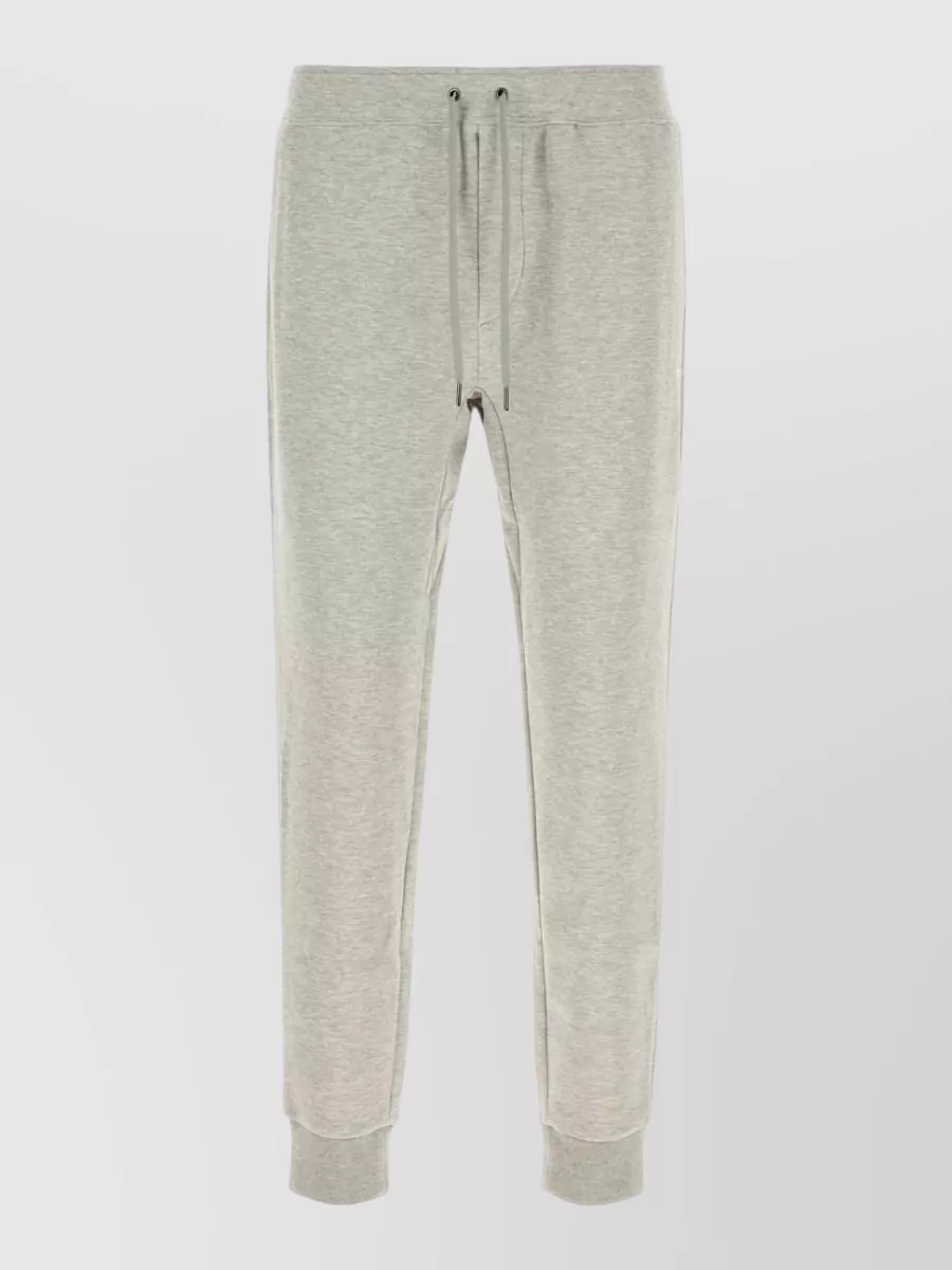 Polo Ralph Lauren Straight track pants — The light heather grey jogger keeps the outfit in the minimalist preppy-sport lane, softens the black sweatshirt with a classic grey-sweat set contrast, and suits the relaxed tapered silhouette.