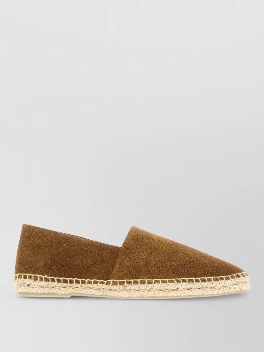 Tom Ford Suede leather espadrilles — The tan Tom Ford suede espadrilles deliver relaxed Mediterranean polish that pairs perfectly with navy shorts and a white camp shirt, maintaining the quiet-luxury, SS mood without feeling too sporty.