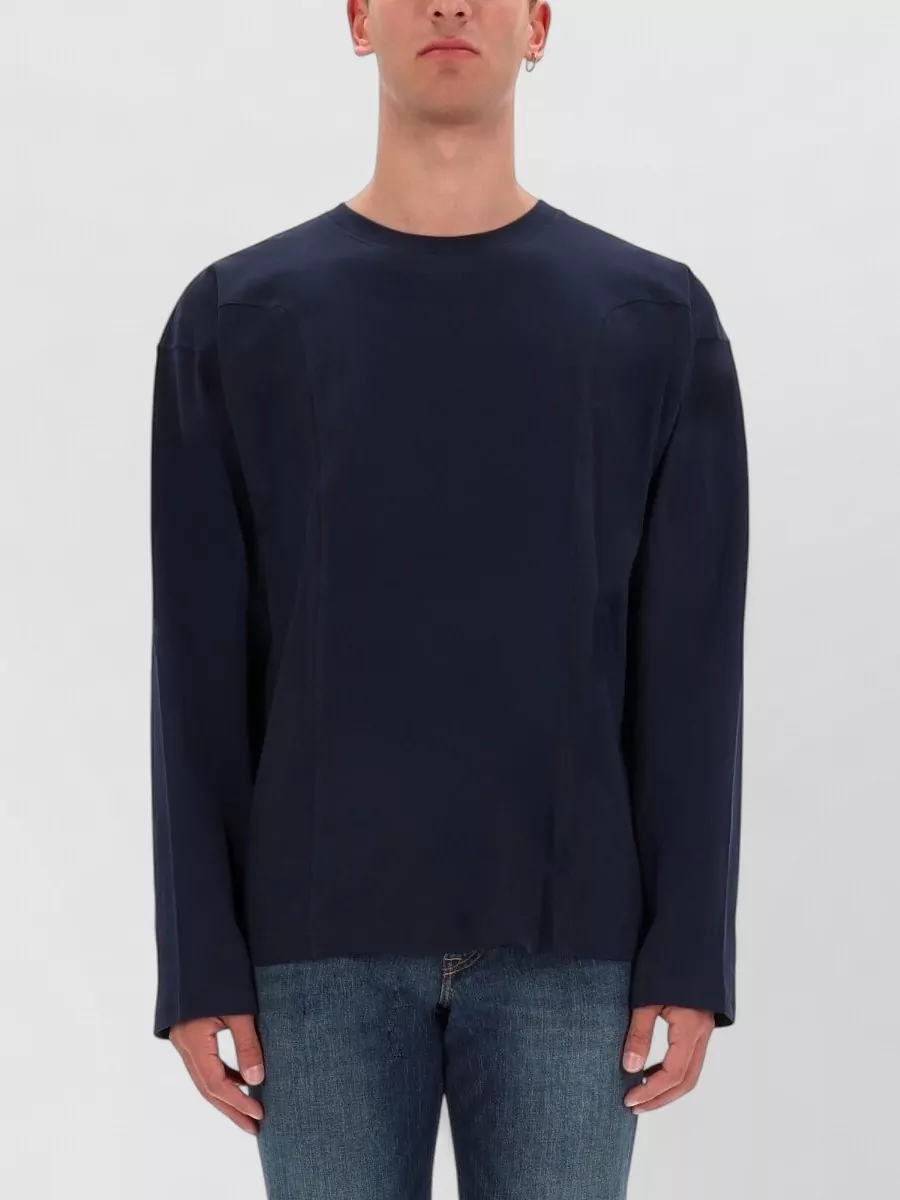 Diesel Cotton sweatshirt — The deep navy crewneck mirrors the jacket’s navy side panels for a clean, tonal street-sport layer that keeps the silhouette sharp rather than bulky under the short shell.