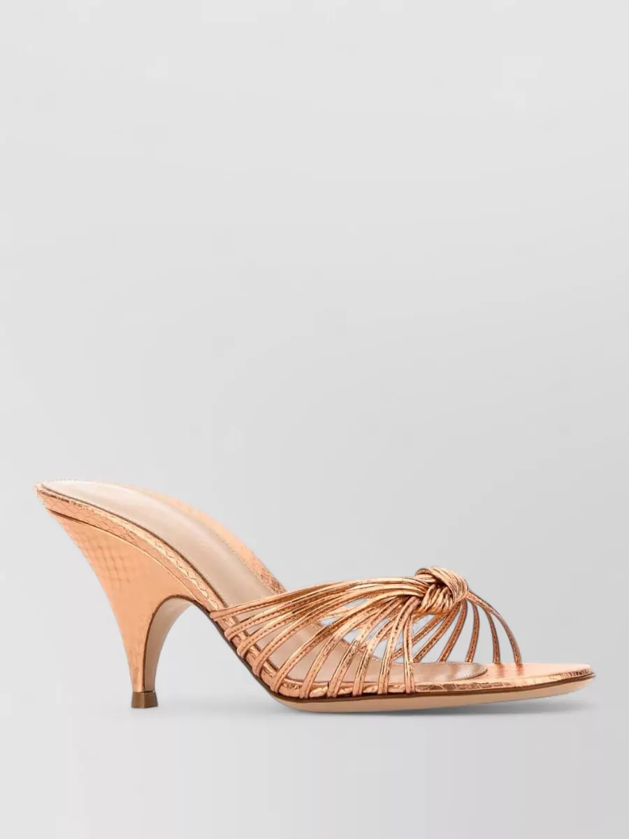 Gianvito Rossi Leather mules — The Gianvito Rossi rose-gold kitten-heel mules add refined metallic shine that picks up the pants’ glitter thread, giving evening polish without overpowering the patterned Missoni set.